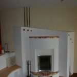 Kachelofen mit halbrunder Sitzbank vom Ofenbauer Senemann